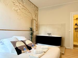 Appartements Relax Inn Champagne - Reims Balneo : photos des chambres