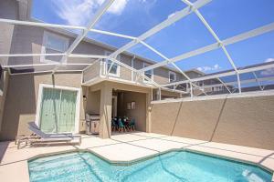 4Q3B Casa luxuosa no Champions Gate Resort