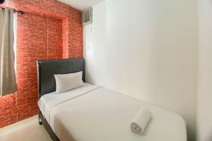 Comfort and Homey 3BR Bassura City Apartment By Travelio