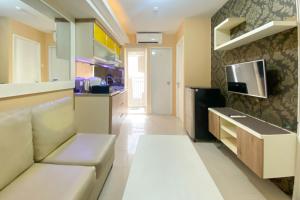 Restful and Modern 2BR Bassura City Apartment By Travelio