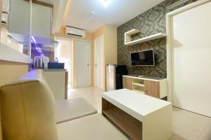 Restful and Modern 2BR Bassura City Apartment By Travelio