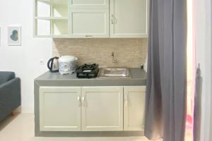 Full Furnished and Homey 2BR Bassura City Apartment near Mall By Travelio