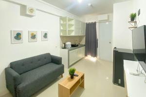 Full Furnished and Homey 2BR Bassura City Apartment near Mall By Travelio