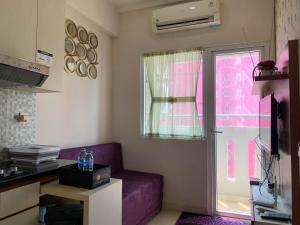 Modern Look and Comfortable 2BR Green Pramuka City Apartment By Travelio