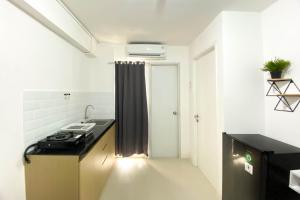 Comfort Living and Strategic 2BR at Bassura City Apartment By Travelio