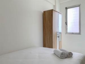 Cozy 2BR at Delta Cakung Apartment By Travelio