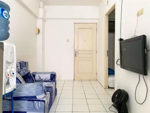 Cozy 2BR at Delta Cakung Apartment By Travelio
