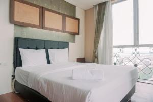 Spacious and Homey 2BR Mangga Dua Apartment By Travelio