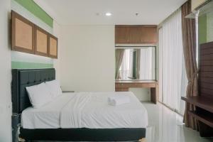 Spacious and Homey 2BR Mangga Dua Apartment By Travelio
