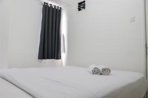 Cozy Stay 3BR Bassura City Apartment near Mall By Travelio
