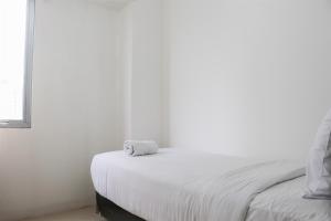 Cozy Stay 3BR Bassura City Apartment near Mall By Travelio
