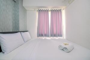 Comfy 2BR Apartment at Bassura City By Travelio