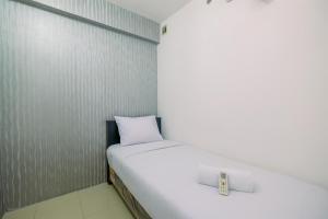 Comfy 2BR Apartment at Bassura City By Travelio