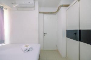 Comfy 2BR Apartment at Bassura City By Travelio