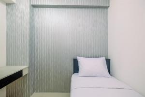 Comfy 2BR Apartment at Bassura City By Travelio