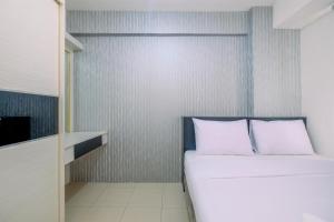 Comfy 2BR Apartment at Bassura City By Travelio