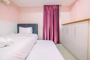 Comfortable and Homey 2BR Apartment at Royal Olive Residence By Travelio