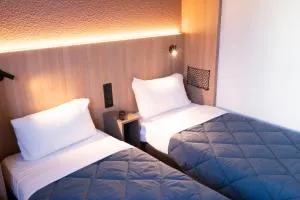 普瑞米尔巴黎西杰内维利尔经典酒店 - 热讷维耶