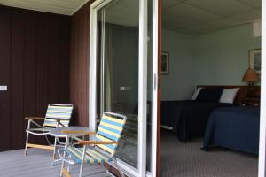 Quadruple Room with Lake View room in Sandy Point Motel