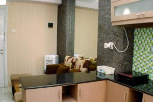Nice and Best Deal 2BR at Green Pramuka City Apartment By Travelio