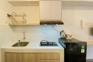 Warm and Homey Studio Tokyo Riverside PIK 2 Apartment By Travelio