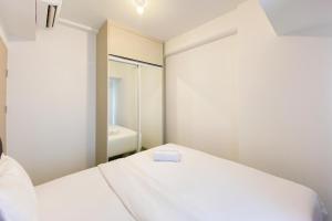 Homey Living 2BR at Tokyo Riverside PIK 2 Apartment By Travelio