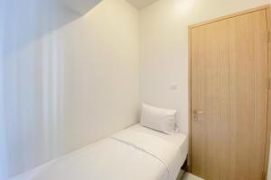 Homey and Comfortable 2BR at Tokyo Riverside PIK 2 Apartment By Travelio
