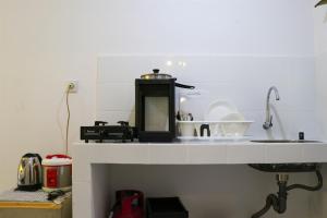 Compact and Tidy Studio at Tokyo Riverside PIK 2 Apartment By Travelio