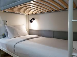 Minimalist and Cozy 2BR at La Hub City Apartment By Travelio