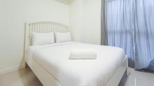 Comfortable and Tidy 2BR at Vida View Apartment By Travelio