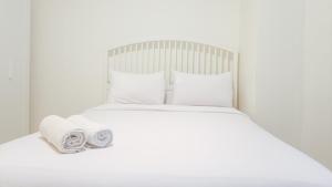 Comfortable and Tidy 2BR at Vida View Apartment By Travelio