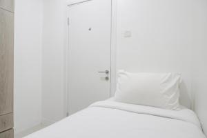 Cozy and Well Designed 2BR at Green Pramuka City Apartment By Travelio