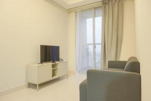 Fancy and Comfort 1BR at Gold Coast Apartment By Travelio