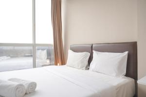 Good Deal and Restful 1BR Ciputra International Apartment By Travelio