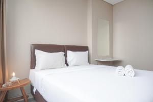 Good Deal and Restful 1BR Ciputra International Apartment By Travelio
