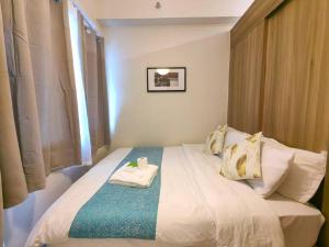 1BR Condotel with Balcony at FAME Residences #FM52