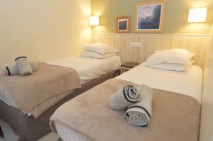 Appartements Maison Normandy Garden : photos des chambres