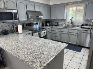 Charming 3 Bedroom Farmhouse Retreat with Open Deck