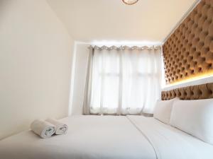 Comfort 2BR at 28th Floor Vida View Makassar Apartment By Travelio