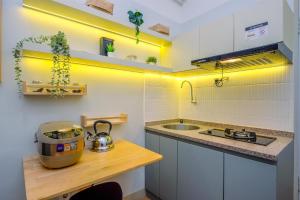 Great Choice and Cozy 2BR at Green Pramuka City Apartment By Travelio