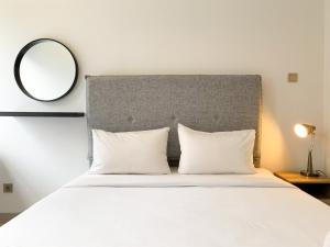 Elegant Studio at Transpark Cibubur Apartment near Shopping Mall By Travelio