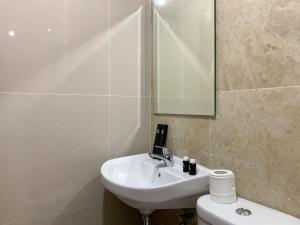 Elegant Studio at Transpark Cibubur Apartment near Shopping Mall By Travelio