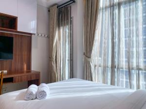 Modern and Comfort Studio Room Apartment at Capitol Park Residence By Travelio