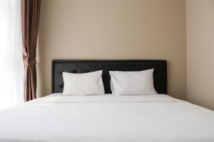 Spacious and Homey 2BR at Ciputra International Apartment By Travelio