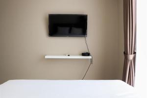 Spacious and Homey 2BR at Ciputra International Apartment By Travelio