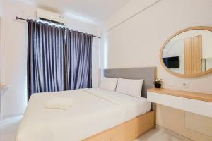 Best Homey Studio at Sky House BSD Apartment By Travelio
