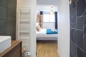 Appartements DK Lodges Netflix Wifi Proche centre ville : photos des chambres
