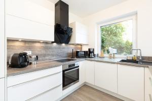 Komfort-Ferienhaus "Heimathafen" Mittelweg 43c APPARTO Grömitz