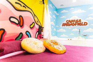 Appartements Capsule Springfield - Balneo -Sauna - Billard : photos des chambres