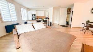 Appartements Le Coin des Voyageurs -proche Disneyland : photos des chambres
